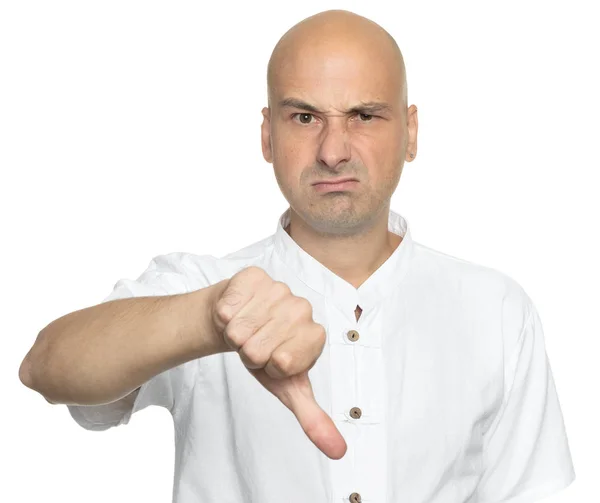 Unhappy bald man showing thumbs down sign — Stock Photo, Image