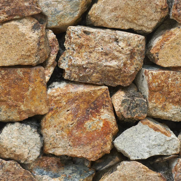 Latar belakang dinding batu tua. Tekstur tak berjahit — Stok Foto