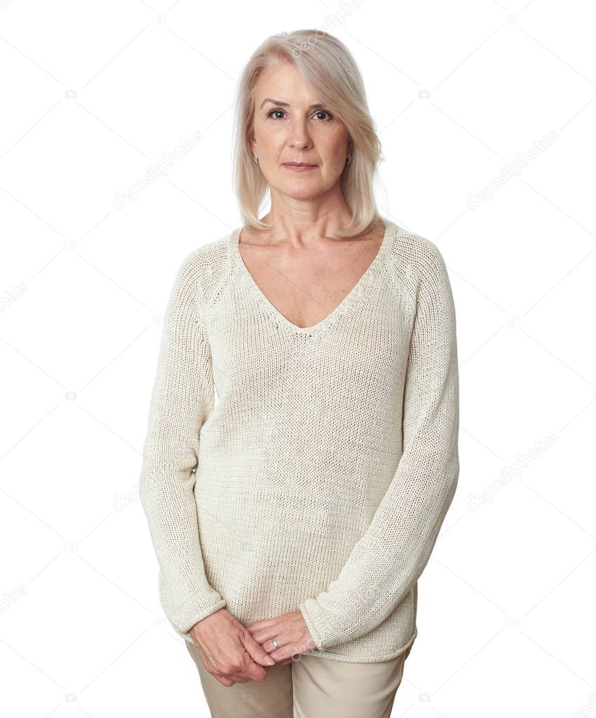 casual mature woman while standing against white background