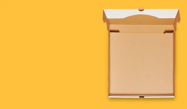 Opened cardboard pizza box template isolated on yellow background with clipping path