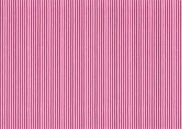 Corrugated colored cardboard pink vintage color. Textural paper