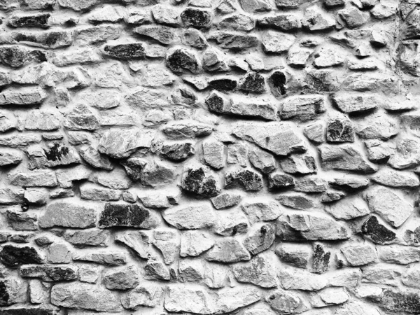 Masonry wall. Textured background of large stones, handmade.