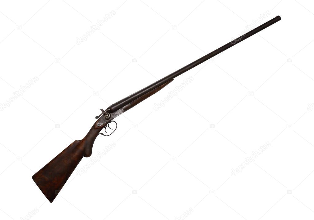 Ancient hunting shotgun closeup isolated on white background with clipping path