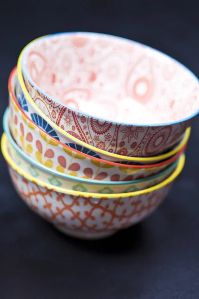 Stack of colorful empty ceramic bowls closeup. — Stock Photo, Image