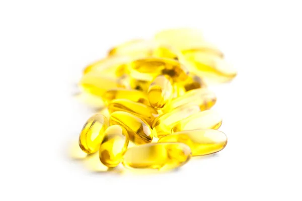 Omega-3 ropné kapsle a vitamín pro zdravotní péči izolované na frmol — Stock fotografie