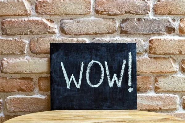 Chalk board with the word WOW! drown by hand and chalks on woode — Stock Photo, Image