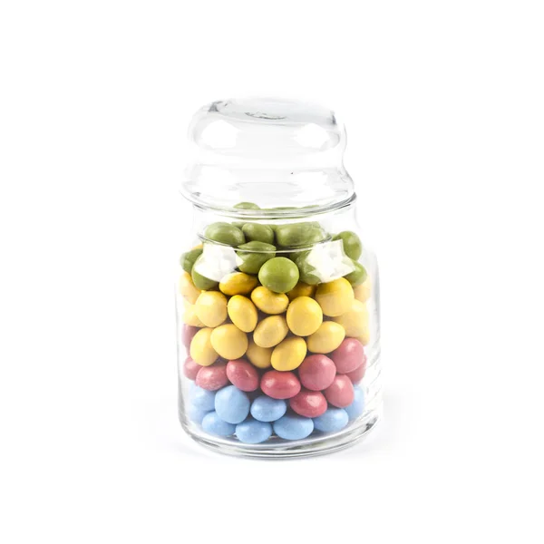 Colorful sweet candies in glass jar isolated on white. — Stock Photo, Image