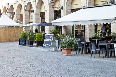 Fermo, Italy - June 23, 2019: Summer day and utdoor restaurant clipart