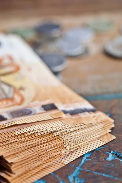 Pile of fifty euro banknotes and coins. — Stock Photo, Image