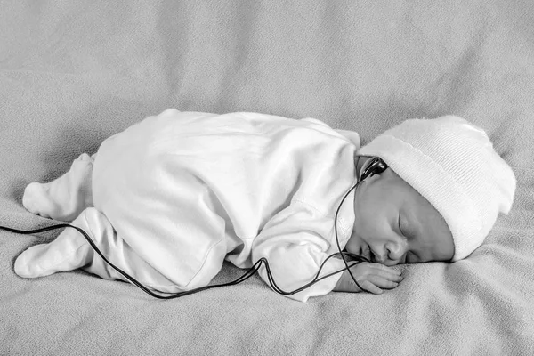 Newborn Sleeps Kid Listening Music Ear Phones Black White — Stock Photo, Image