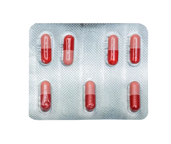 Πακέτο Κόκκινο Χάπια Που Απομονώνονται Λευκό Φόντο — Φωτογραφία Αρχείου