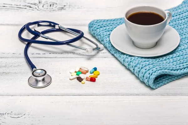 Cup Coffee Turquoise Scarf Stethoscope Pills Wooden Background — Stock Photo, Image