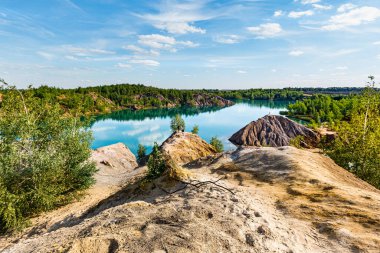 Konduki (Conduky) village, Tula region, Romancevskie mountains, Ushakovsky quarries. Turquoise water lakes. clipart
