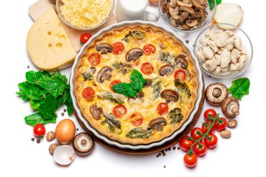 Baked homemade quiche pie in ceramic baking form, eggs and cream clipart