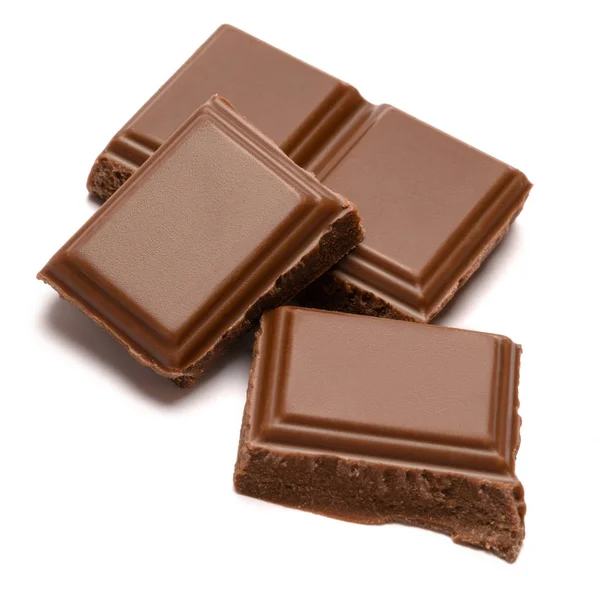 Milk organic chocolate pieces isolated on white background — Stock Photo, Image