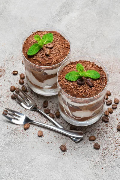 Two portions Classic tiramisu dessert in a glass on concrete background — Stock Photo, Image