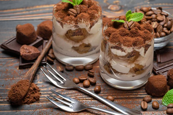Two portions Classic tiramisu dessert in a glass on wooden background — Stock Photo, Image
