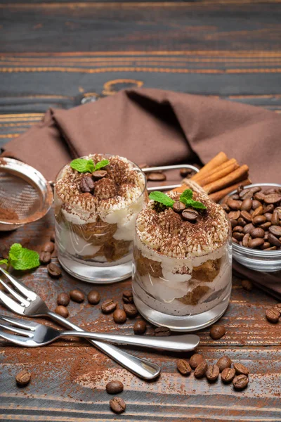 Two portions Classic tiramisu dessert in a glass on wooden background — Stock Photo, Image