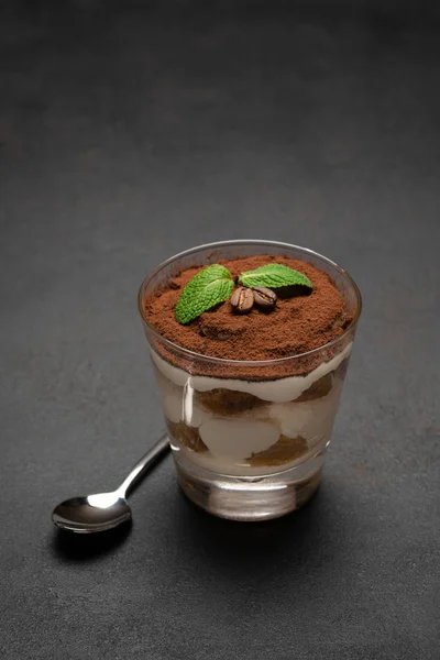 Portion of Classic tiramisu dessert in a glass on concrete background — Stock Photo, Image