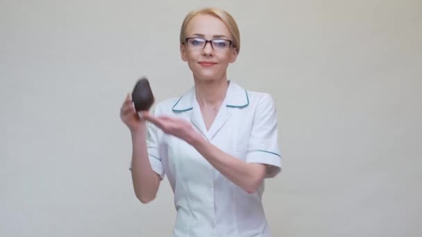 Nutritionist doctor healthy lifestyle concept - holding organic avocado — Stock Video