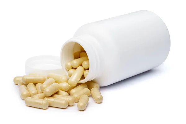 흰 플라스틱 약병을 백지위에 따로 놓을 수있다 — 스톡 사진