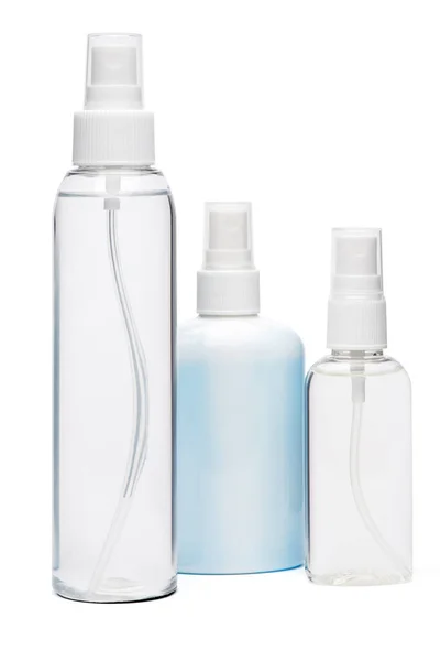 Grupo de mãos desinfetante spray garrafas isoladas em fundo branco — Fotografia de Stock