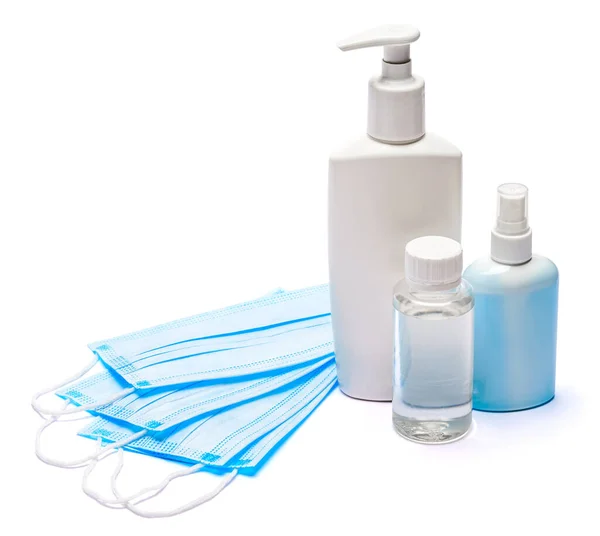 Flasche Creme, Lotion, Desinfektionsmittel oder Flüssigseife und Schutzmaske isoliert auf weißem Hintergrund — Stockfoto