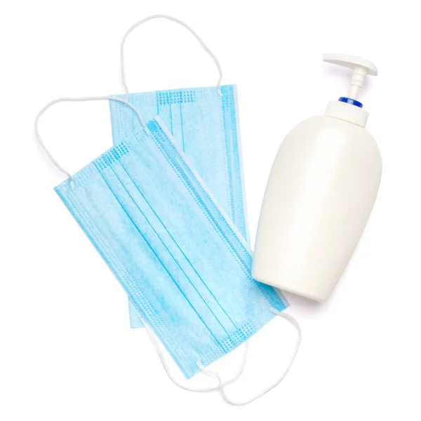 Flasche Lotion, Desinfektionsmittel oder Flüssigseife und medizinische Schutzmaske isoliert auf weißem Hintergrund mit Clipping-Pfad — Stockfoto