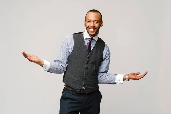 Professional african-american business man - presenting points a hand at copy space — Stock Photo, Image