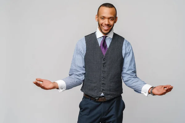 Cheerful smiling happy young african american businessman wearing tie over light grey background looking at the camera smiling with open arms for hug — Stock Photo, Image