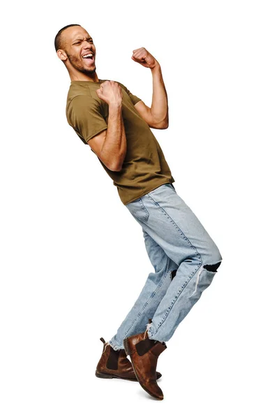 Young African-American man yes win gesturing over white background — Stock Photo, Image
