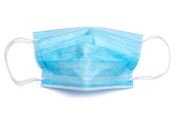 Wegwerp blauw medisch gezichtsmasker geïsoleerd op witte achtergrond met clipping pad — Stockfoto