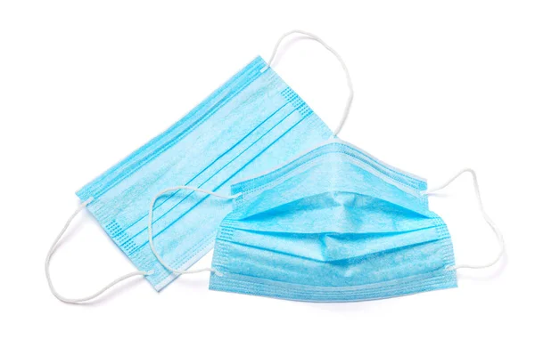 Wegwerp blauw medisch gezichtsmasker geïsoleerd op witte achtergrond met clipping pad — Stockfoto