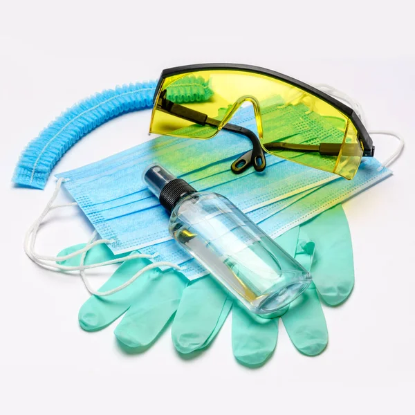 Safety equipment to fight to Coronavirus COVID-19 virus outbreak - Safety mask, hand sanitizer, latex gloves and protective glasses or goggles — Stock Photo, Image