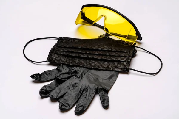 Safety equipment to fight to Coronavirus COVID-19 virus outbreak - Safety mask, latex gloves and protective glasses or goggles — Stock Photo, Image