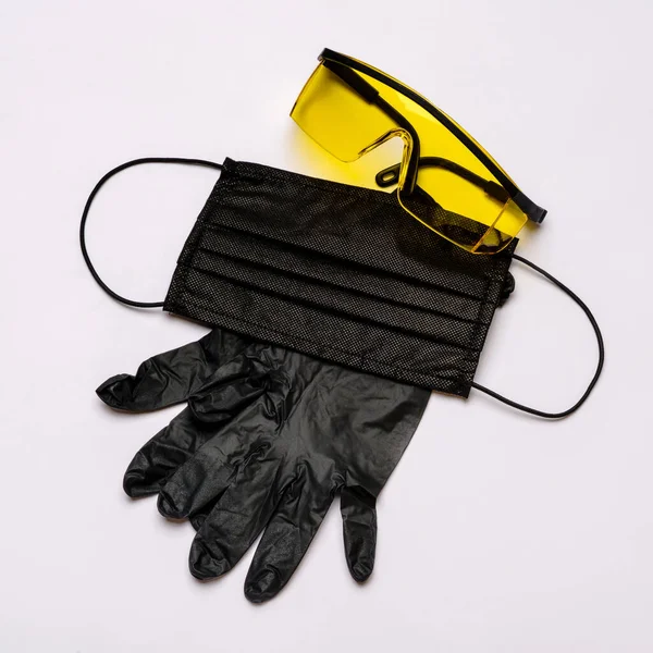 Safety equipment to fight to Coronavirus COVID-19 virus outbreak - Safety mask, latex gloves and protective glasses or goggles — Stock Photo, Image