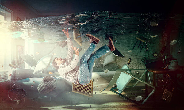 Кавказский человек тонет в своей гостиной абстрактный образ
