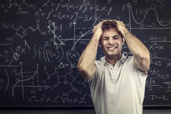 Stressed Young Caucasian Student Chalkboard Background — Stock Photo, Image