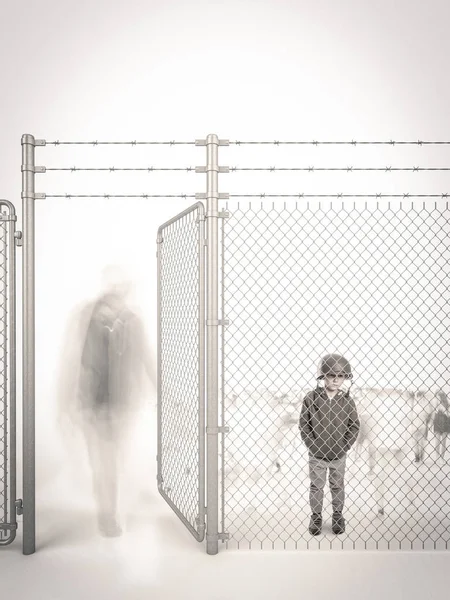 refugee child waits behind a border fence