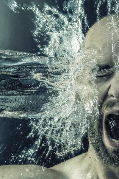 Portrait of a man receiving a bucket of water in his face — Stock Photo, Image