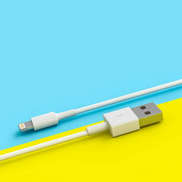 White usb cable on yellow and blue background — Stock Photo, Image