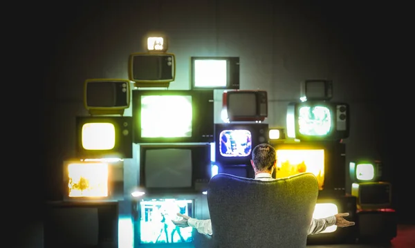 Man Sitting Armchair Looks Many Retro Televisions Turned Concept Loneliness — Stock Photo, Image