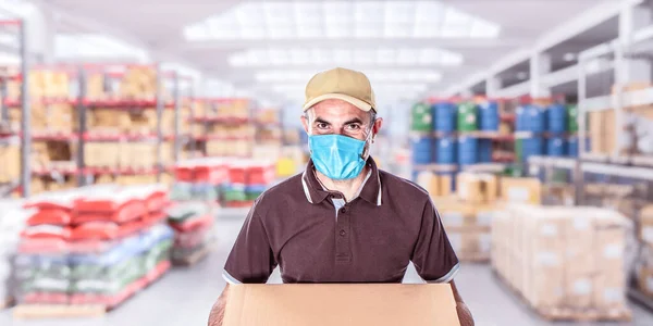 worker with mask in a warehouse full of goods