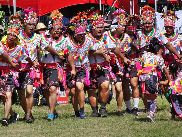 KAOHSIUNG, TAIWAN -- SEPTEMBER 29, 2018: Members of the indigenous Amis tribe in traditional costumes participate in the yearly harvest festival.