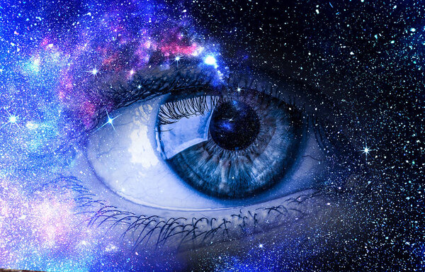 Human eye and space starry fantasy background