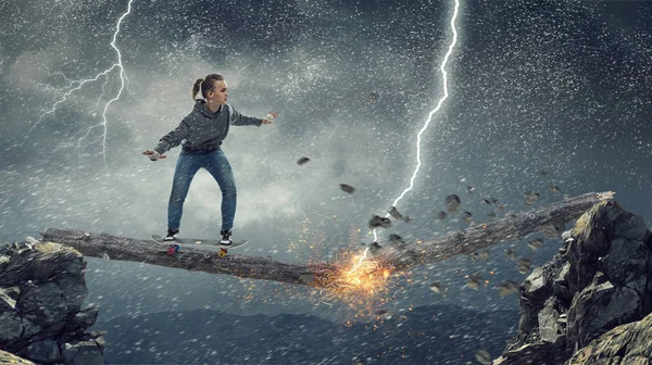 Teenager girl ride her skateboard. Mixed media — Stock Photo, Image