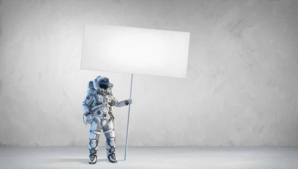 Homem do espaço com banner. Meios mistos — Fotografia de Stock