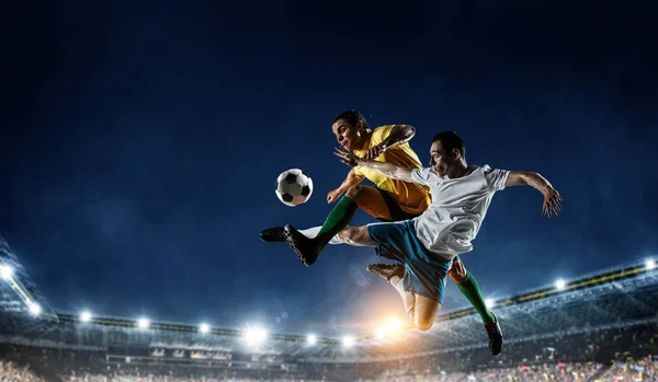 Fotbollspelare på stadion. Mixed media — Stockfoto