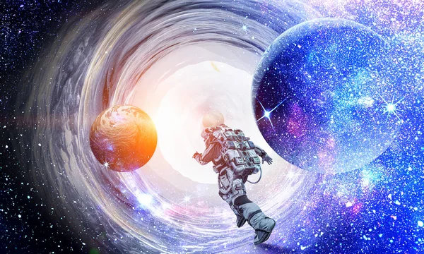 Running spaceman and galaxy. Mixed media — Stock Photo, Image