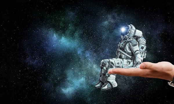 Spaceman on finger. Mixed media — Stock Photo, Image